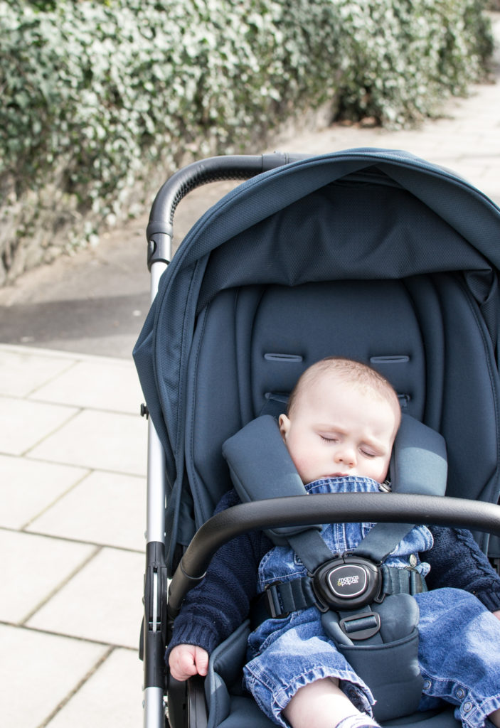 One little boy fast asleep in the buggy 