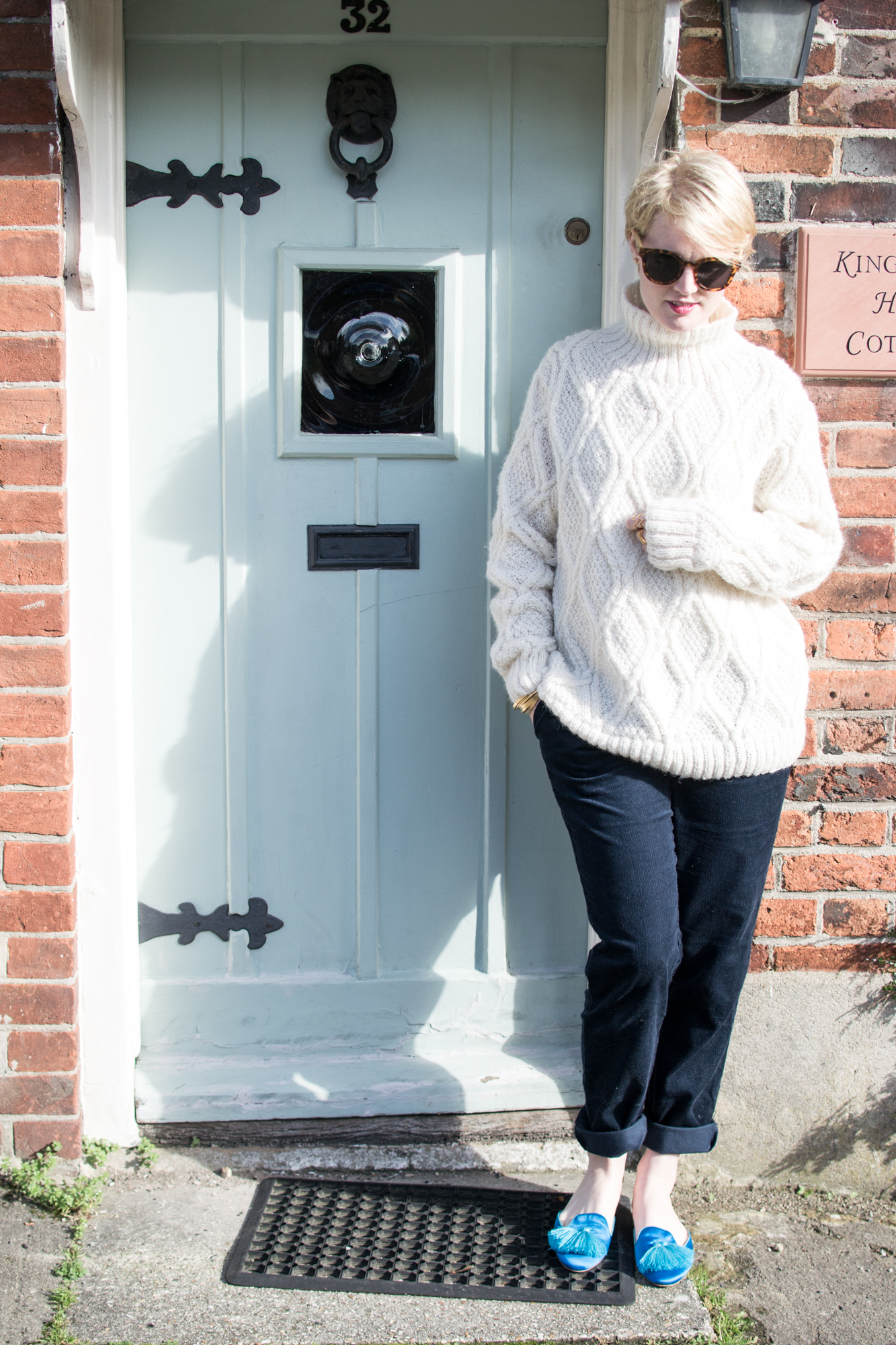 Cream Cable Knit Jumper and navy corduroy trousers People Tree