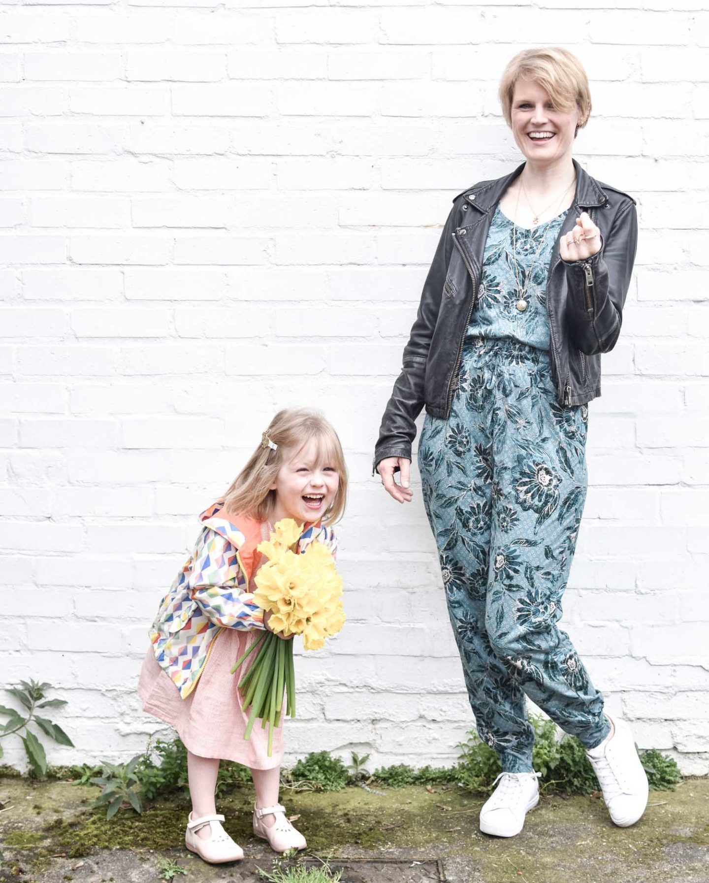 Sustainable Style Blogger Karen Maurice of n4mummy wearing Thoughts floral jumpsuit with a black leather jacket with her daughter Daisy.