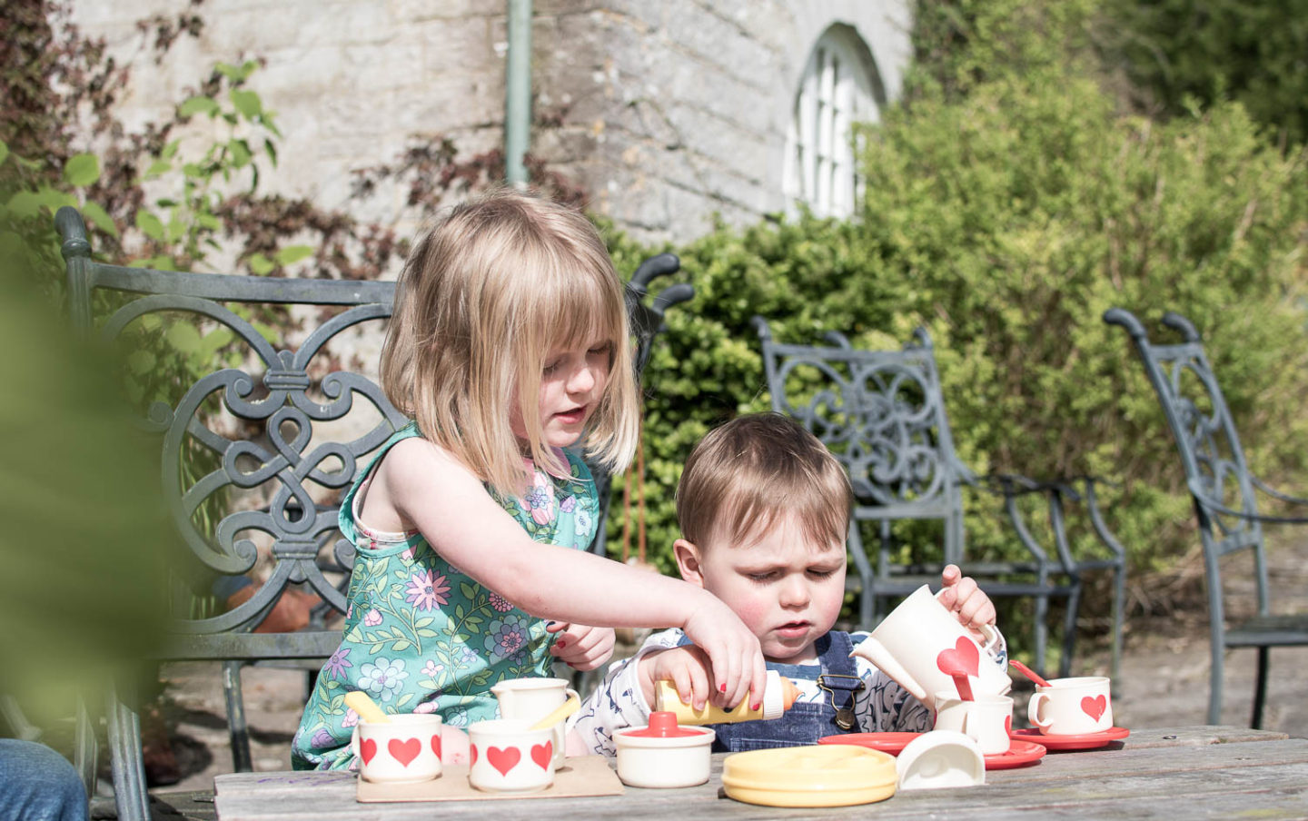 Daisy and Laurie children of lifestyle blogger Karen Maurice, playing making tea at Wootton House