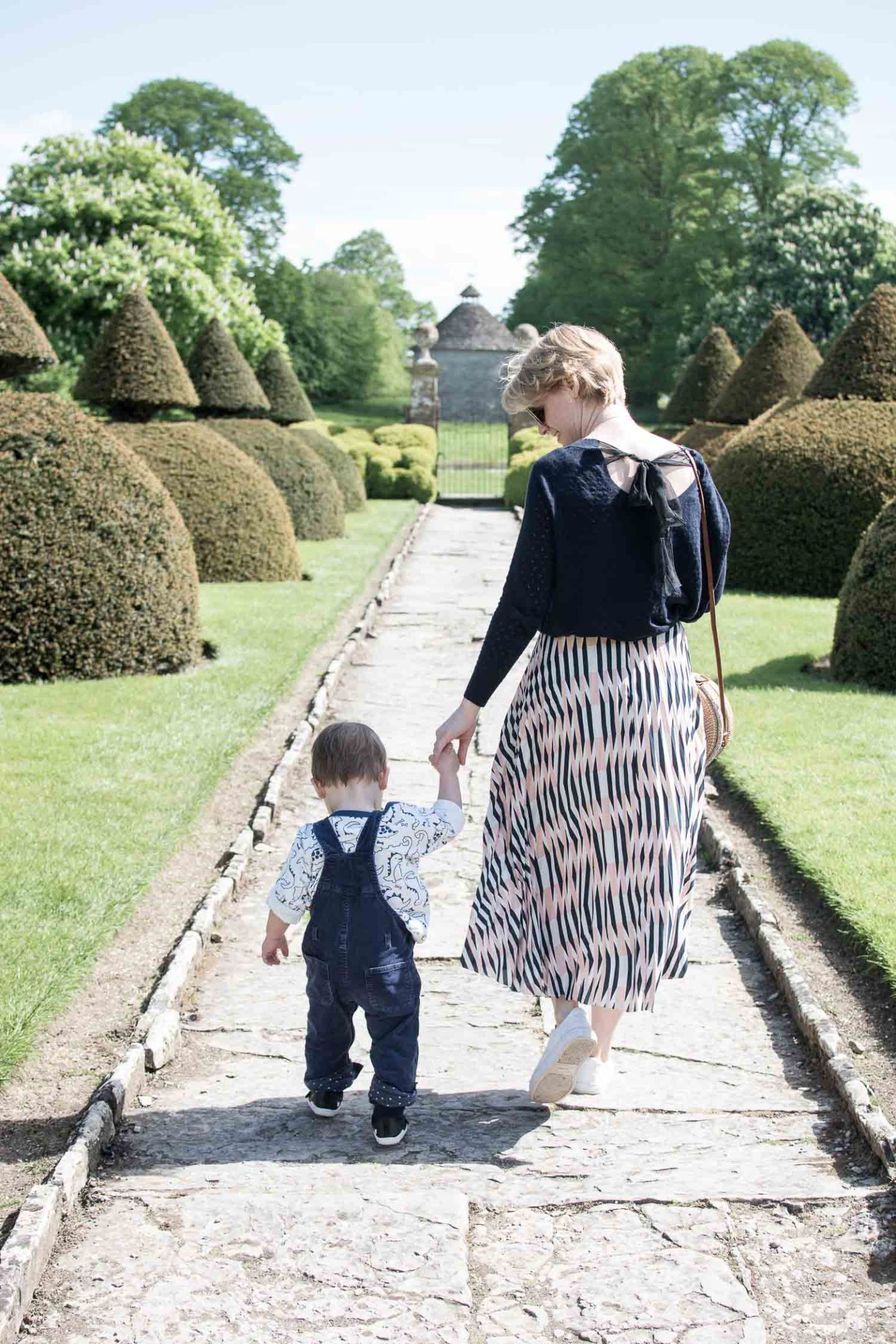 Lifestyle blogger Karen Maurice of n4mummy wearing the fantasy bow knit and pleated pattern skirt