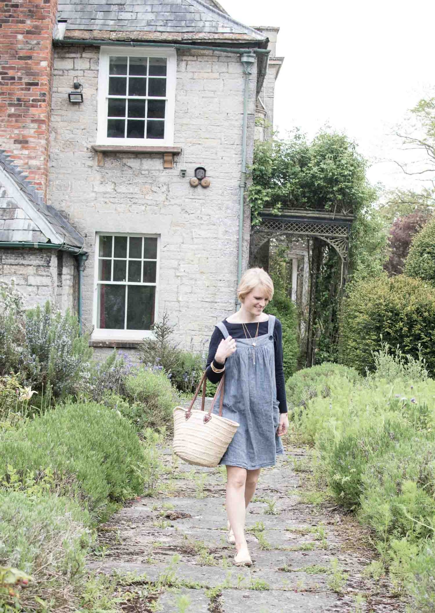 Lifestyle blogger Karen Maurice of n4mummy wearing a blue knit and pinafore dress from Clary and Peg