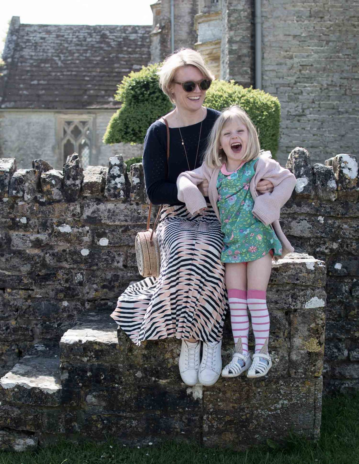 Lifestyle blogger Karen Maurice of n4mummy wearing a navy jumper and patterned skirt