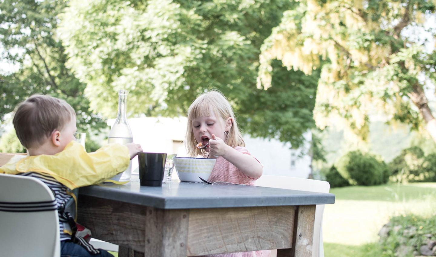 Children of lifetstyle blogger Karen Maurice eating dinner at Weeke Barton