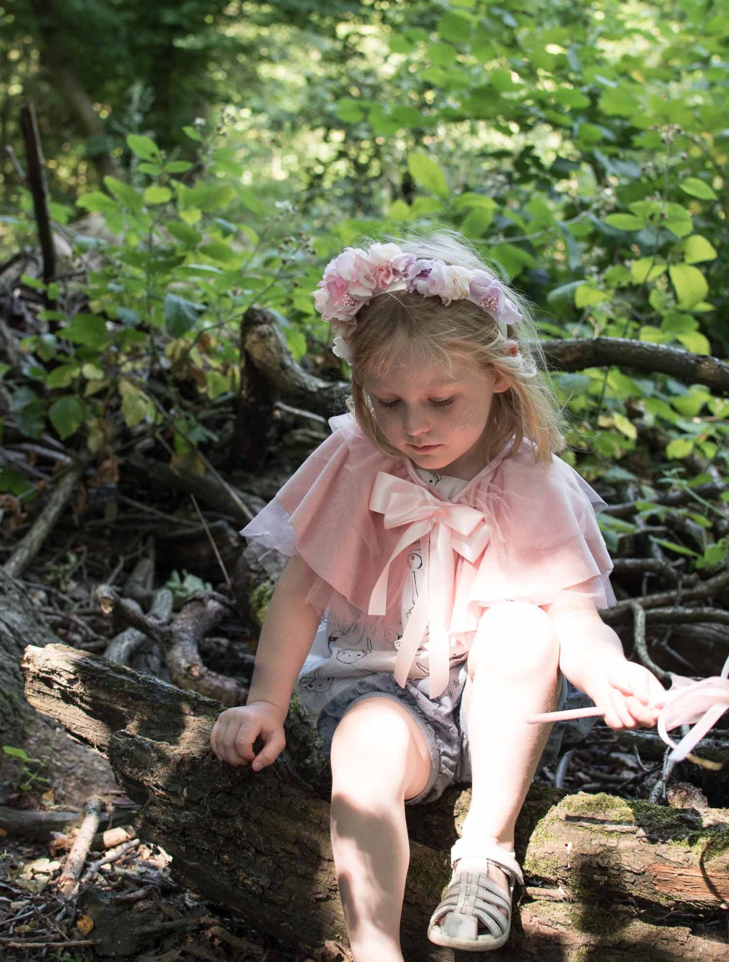 Daisy daughter of Karen Maurice of n4mummy wears a silk flower head piece from Majula Handmade