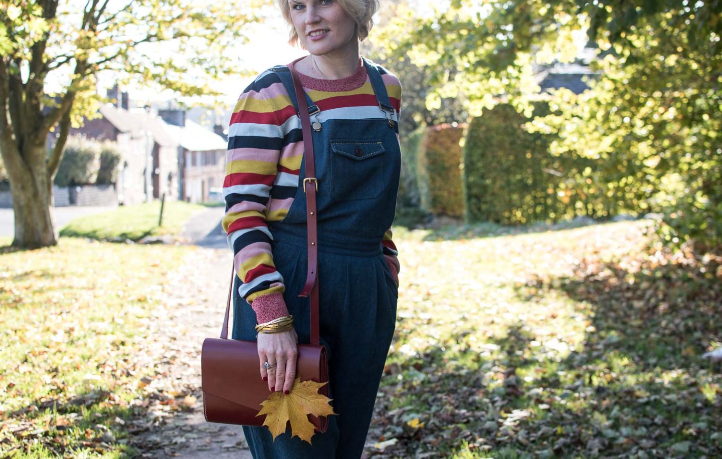 Fashion blogger Karen Maurice of n4mummy in an organic colourful striped jumper and high-waisted dungarees, affordable ethical clothing
