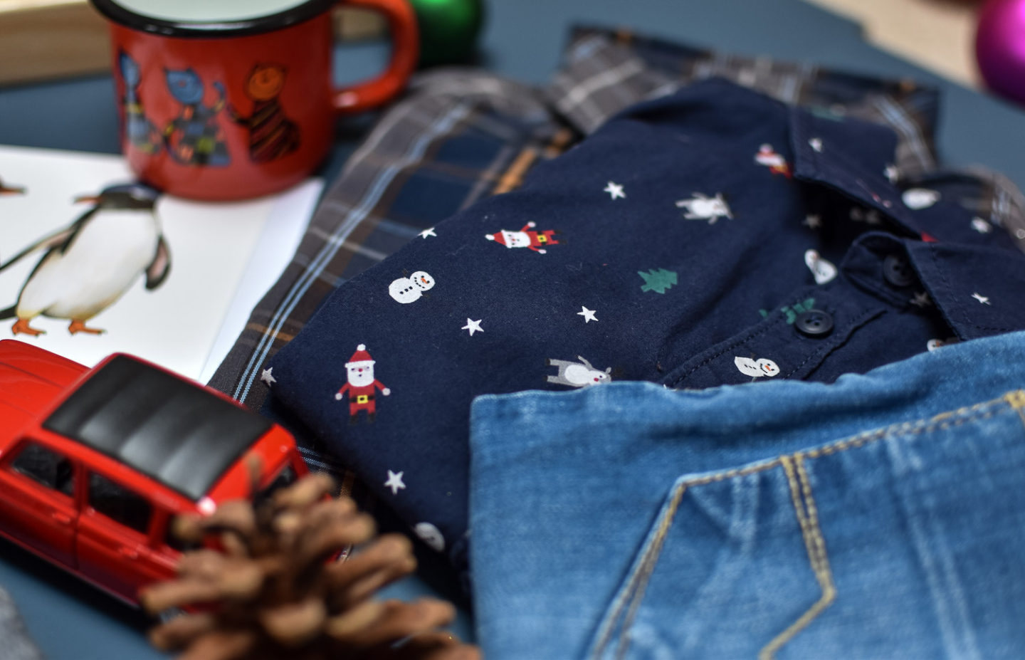 Second hand kids clothing from Loopster, Christmas shirt, check shirt and pair of jeans