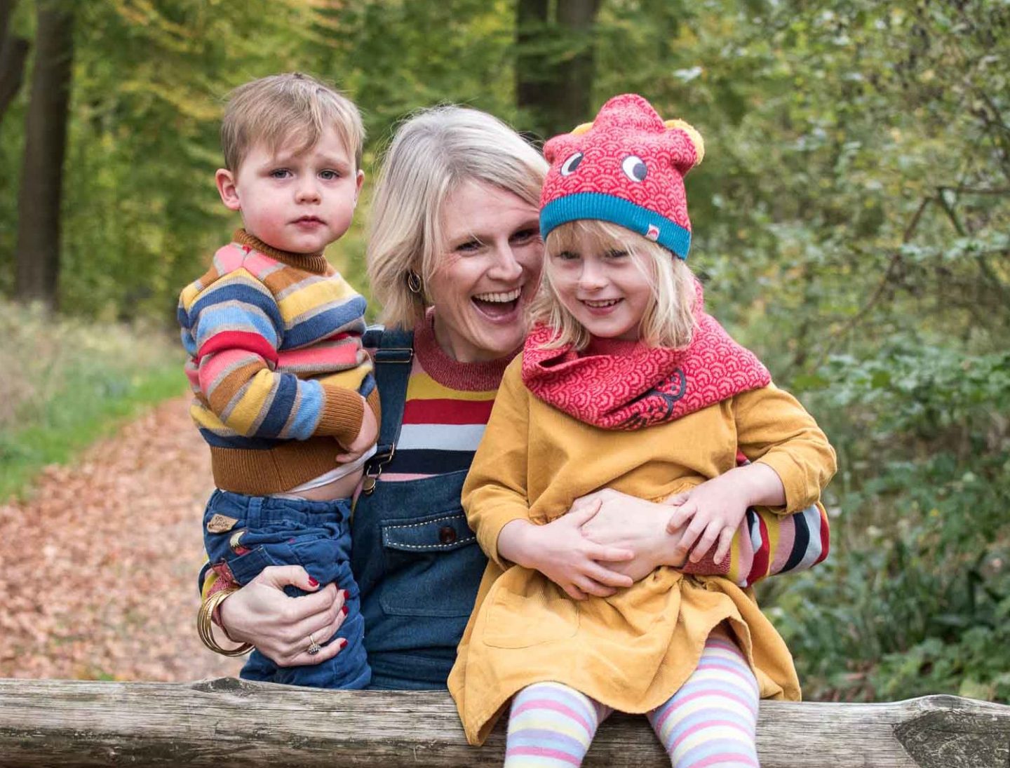 Karen Maurice of n4mummy with her two children wearing colourful stripy jumpers and her daughter wearing Toosta McGinty hat and snood