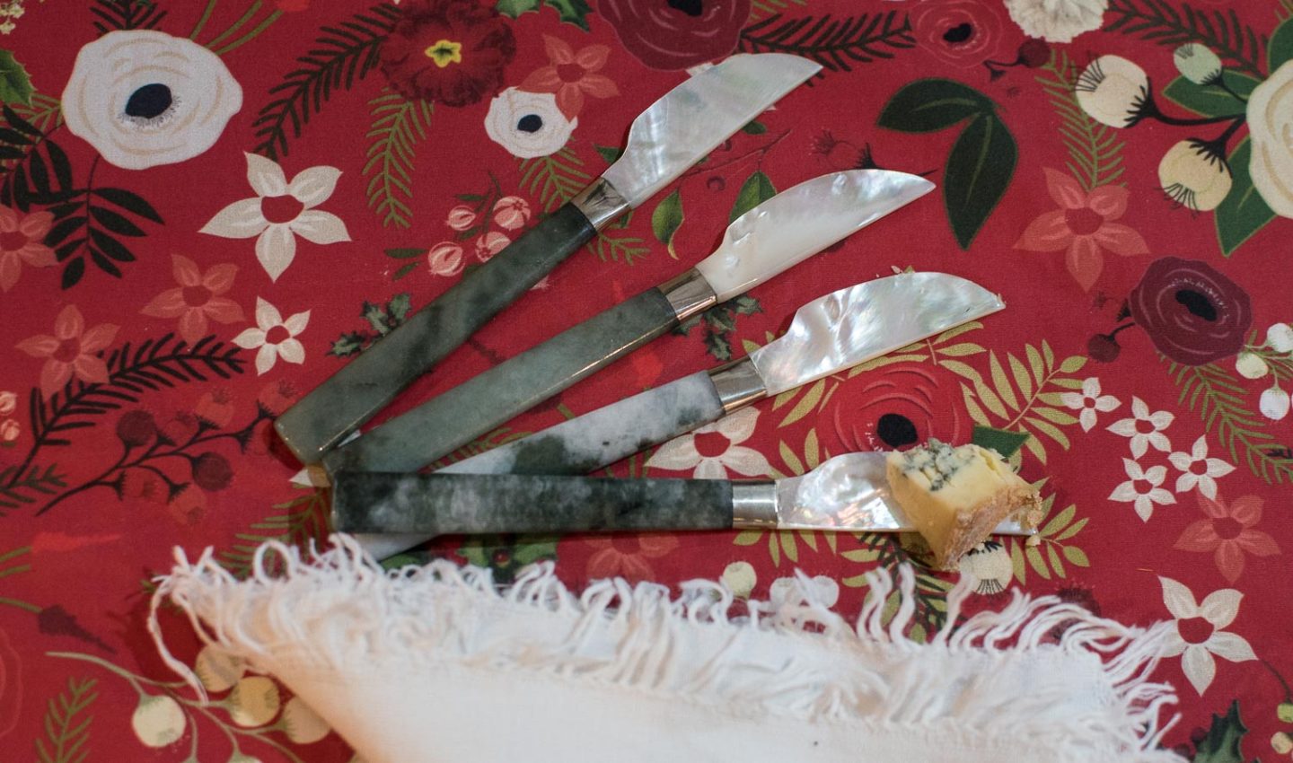 Artisan made butter knives from Kalinko on a table cloth made with fabric from Spoonflower