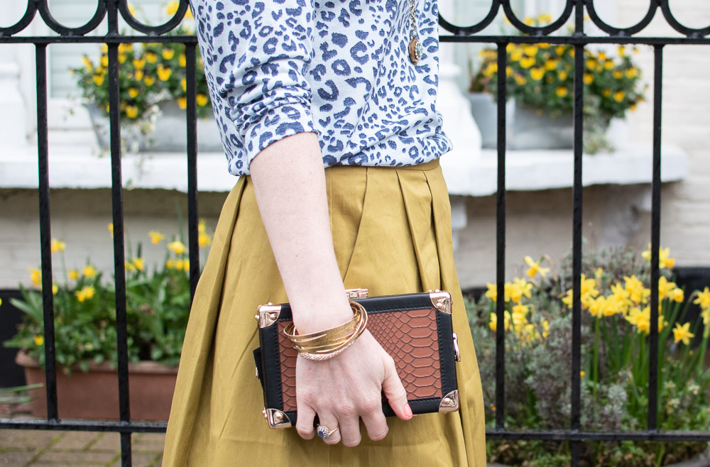 Karen Maurice of n4mummy wears leopard print top and yellow skirt both from Oxfam, carrying a Katherena bag