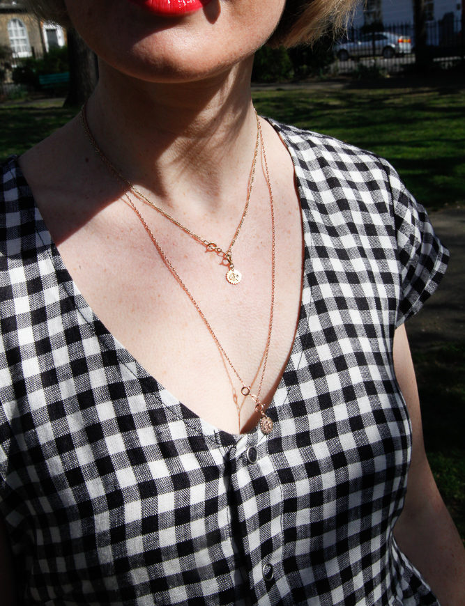 A close up of the linen gingham dress from Beyond Nine