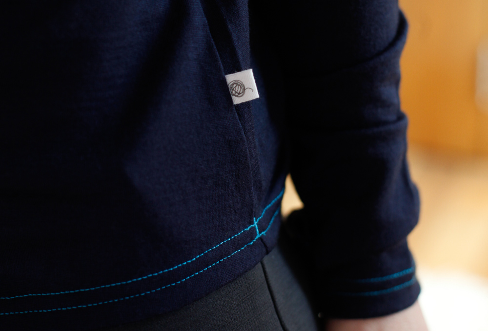 Close up of the Smalls logo and colourful stitching