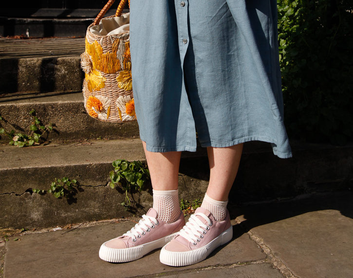 Fishnet socks from ethical fashion brand Mi apparel and pink canvas trainers from Shoe The Bear