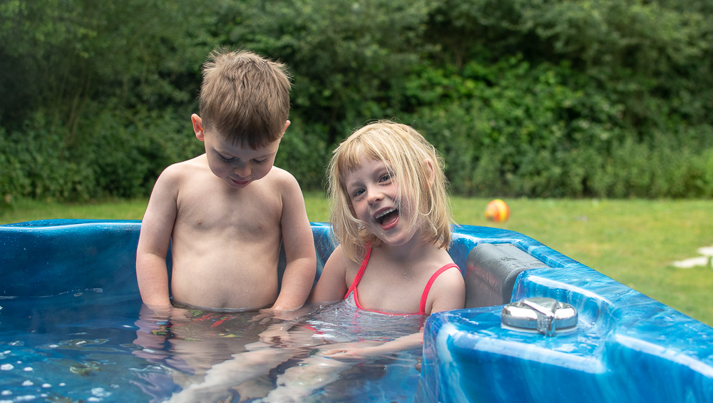 Both kids in the hot tub, glamping at Birdsong Camp, Chigborough Farm and Fisheries