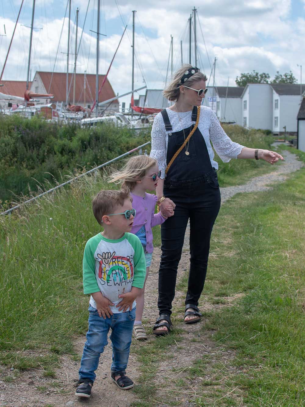 Karen of n4mummy and her children walking along the salt marshes at Tollebsury