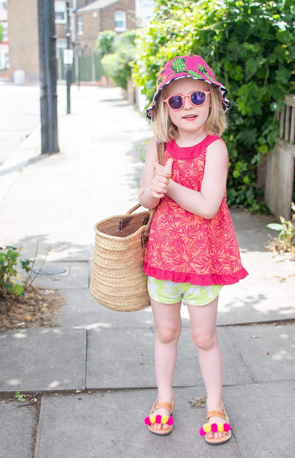 Daisy wears, pink sleeveless top from Loopster (preloved children's clothing)