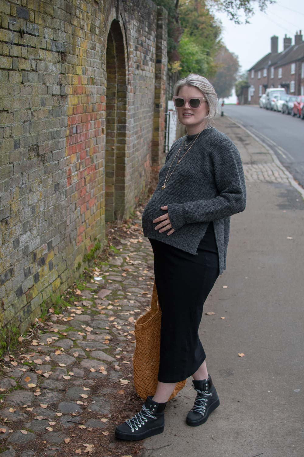 Karen Maurice of n4mummy wears a black midi length dress and waffle knit grey jumper from Boob at 36 weeks pregnant, ethical maternity clothes