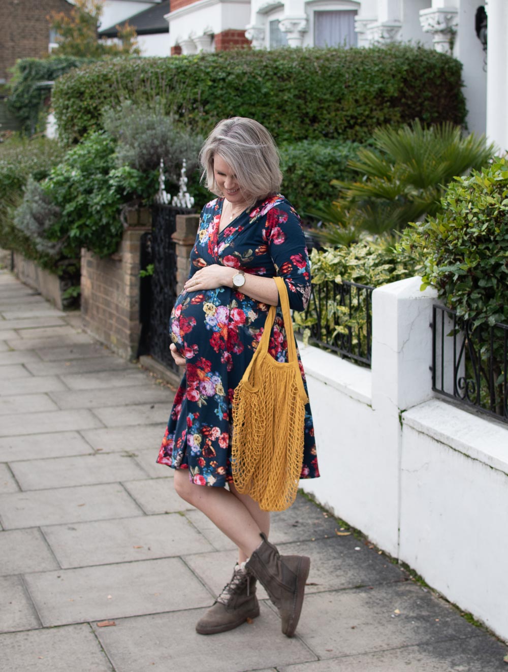 Full length view of Karen Maurice of n4mummy wearing ethical maternity clothes from Tiffany Rose, a floral maternity dress
