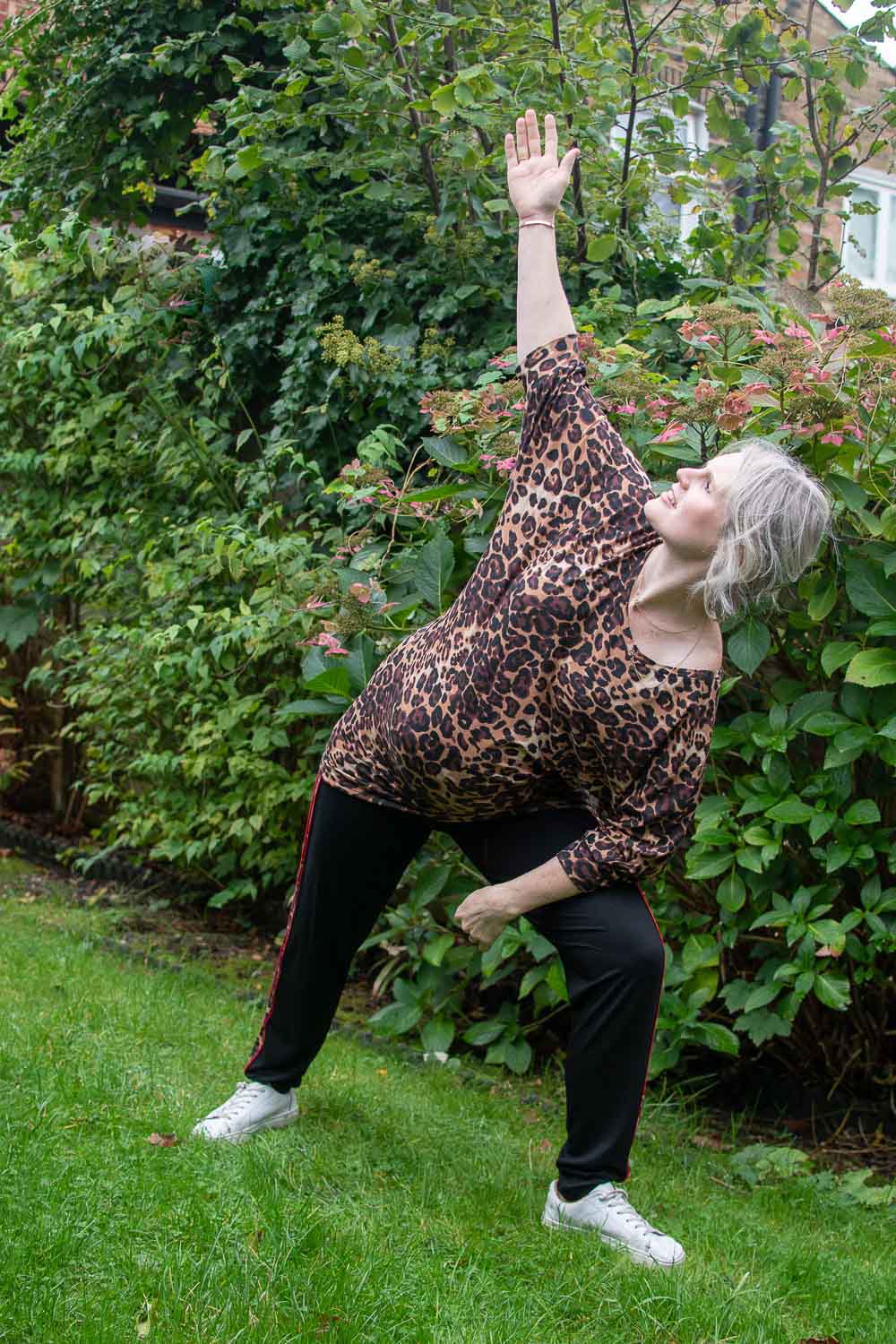 Karen Maurice of n4mummy stretching and wearing eco-friendly activewear: Be Grace Batwing with Divine Trousers from Asquith