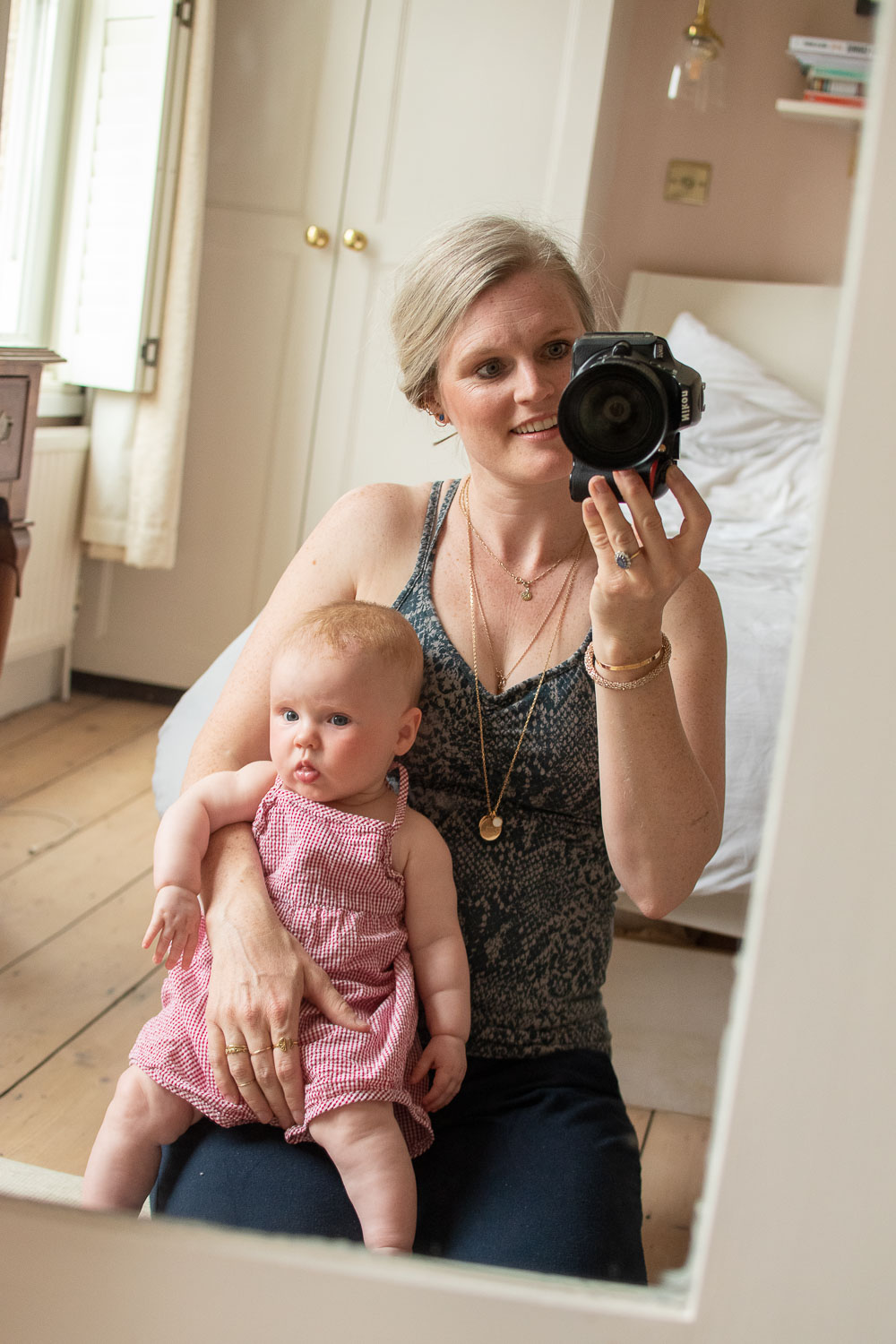 Karen Maurice, sustainable style blogger of n4mummy in eco activewear from Asquith London. A snake print cami and hareem pants. Her daughter is in preloved  baby clothes.