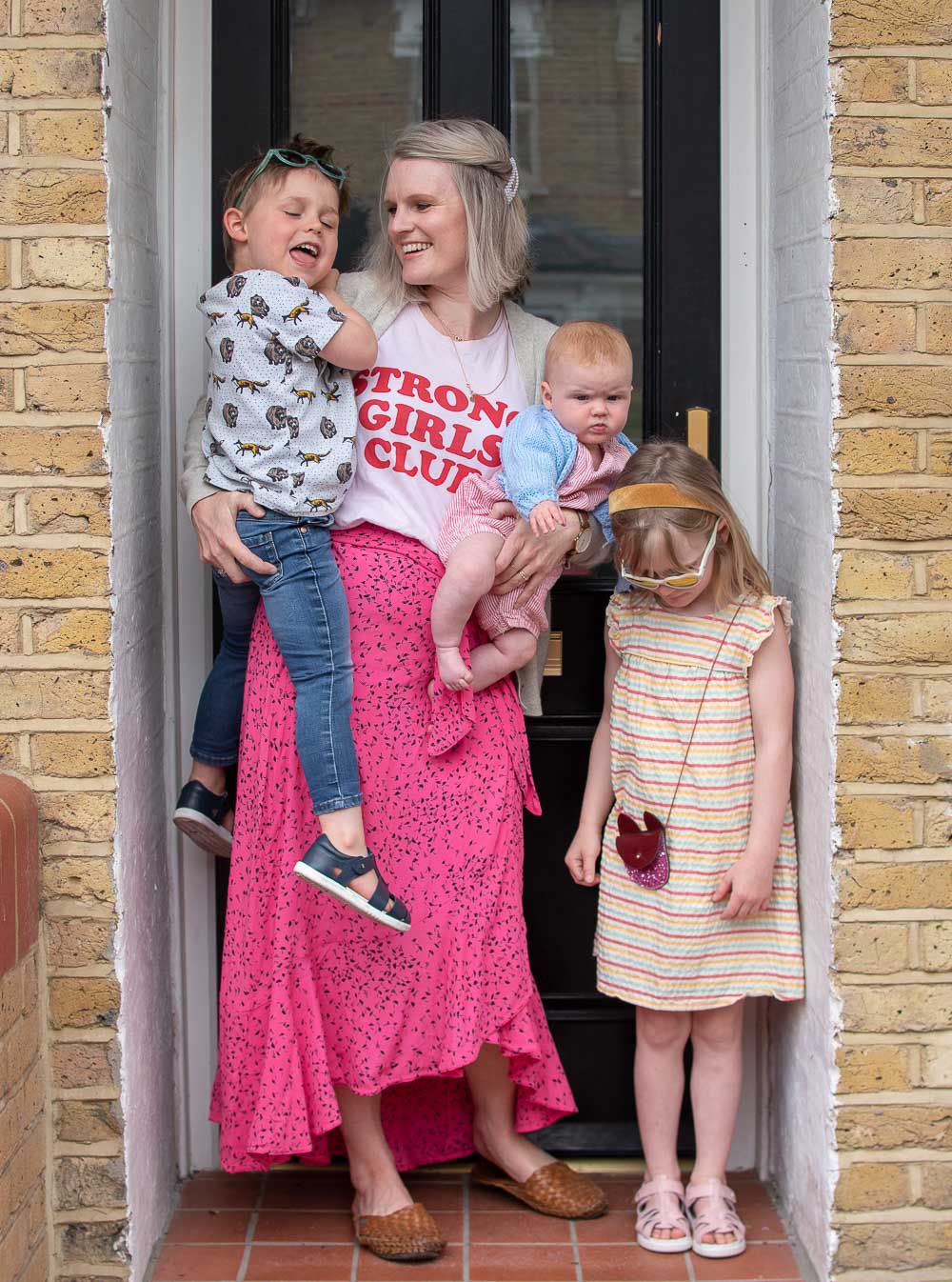 Parenting during lockdown. A lockdown front door portrait, Karen Maurice sustainable blogger, with her three children