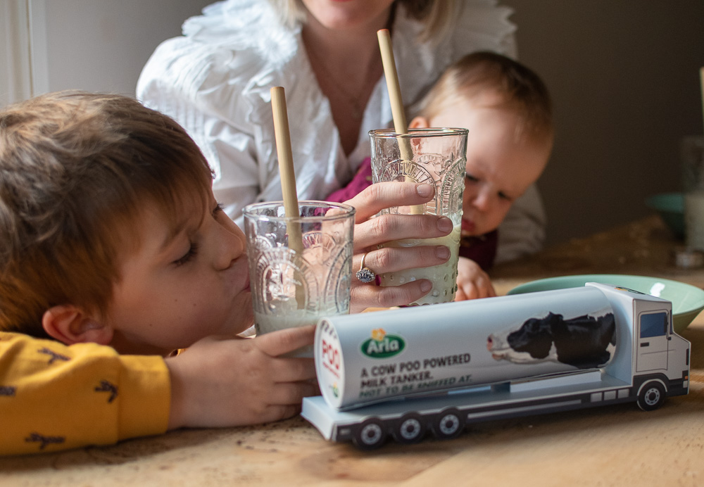 My son enjoying his glass of milk, safe in the knowledge that Arla are trialling turning cow poo into biofuel, to help reduce their carbon footprint. 