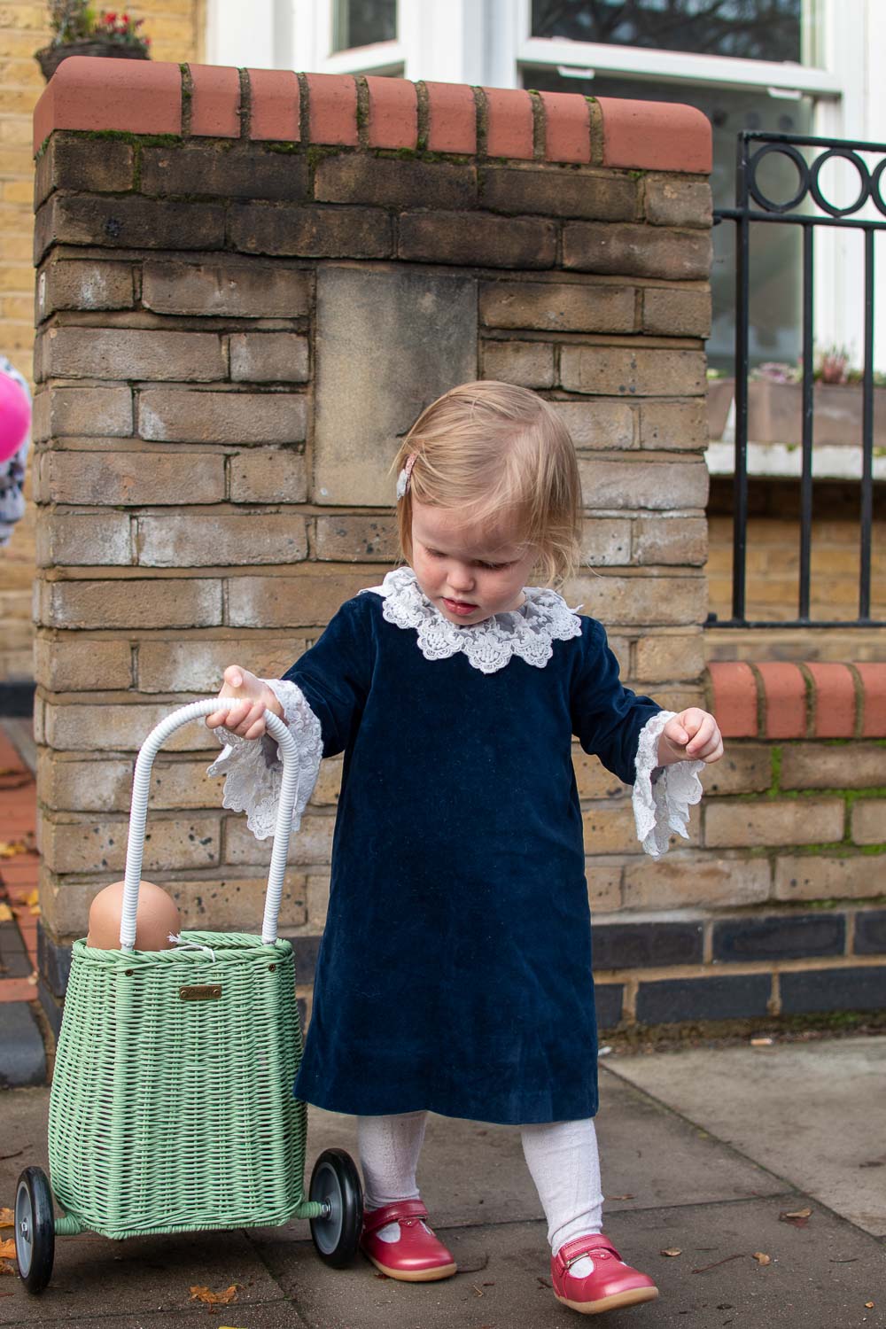 Clara wearing a second hand dress from the kidswear collective 
