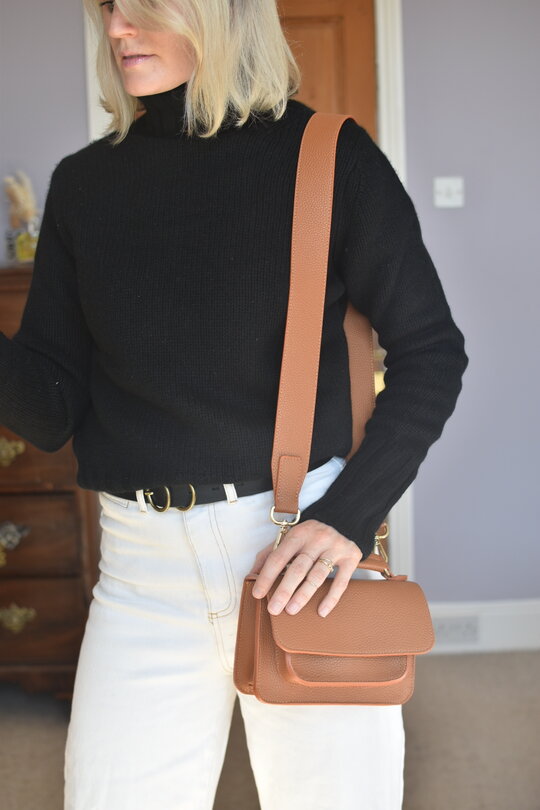Karen Maurice sustainable influencer wearing a black cashmere jumper from Nearly New Cashmere